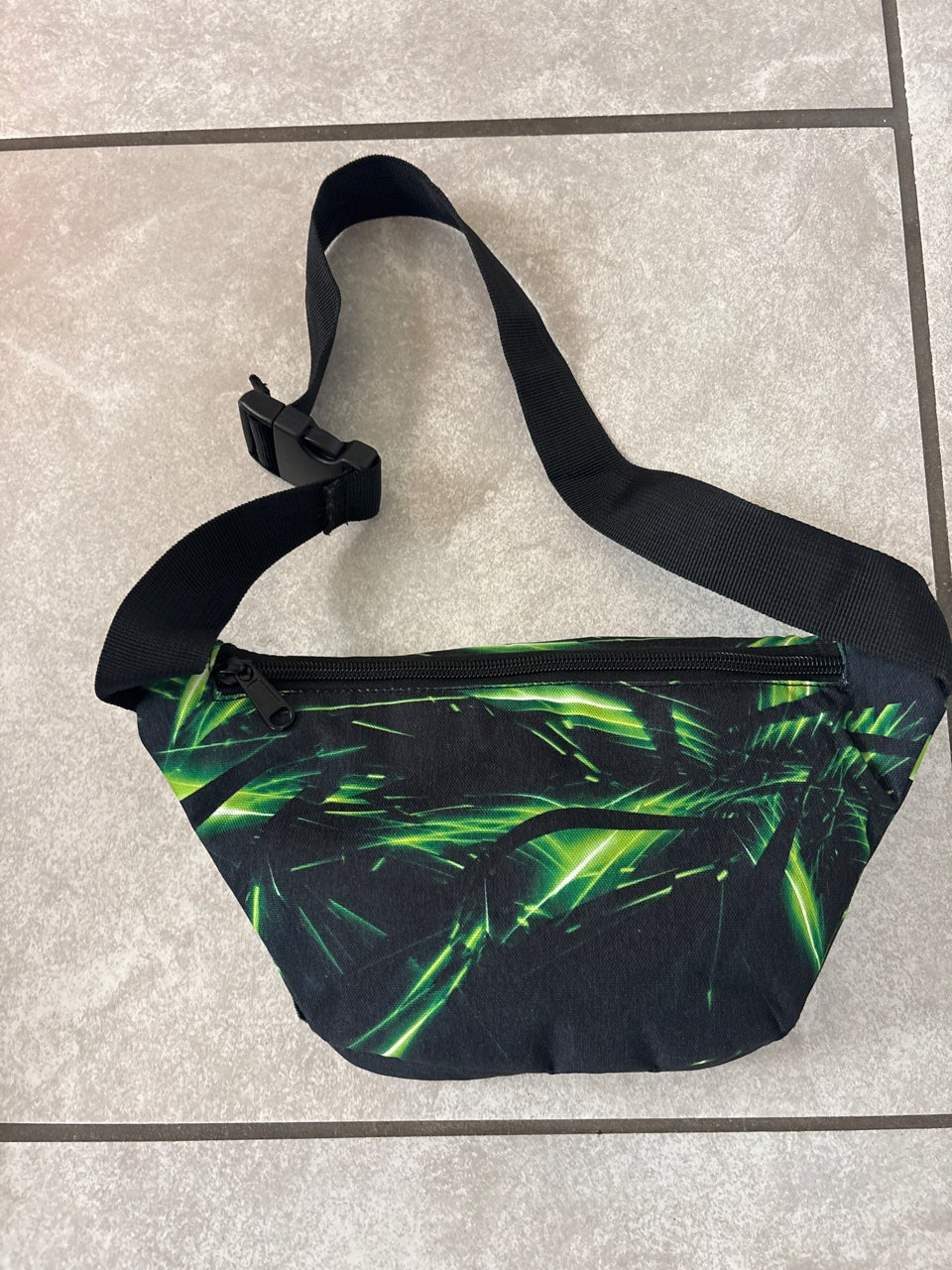 Get Off The Couch Productions fanny pack — back view with adjustable strap and buckle